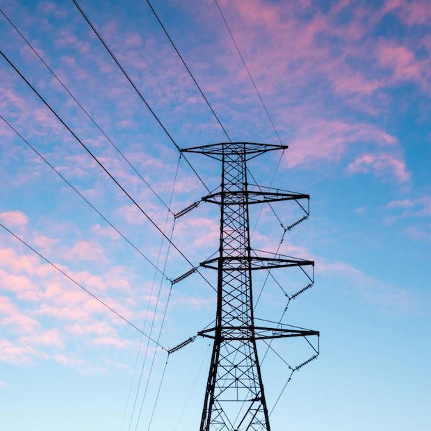 energy transmission lines at sunset