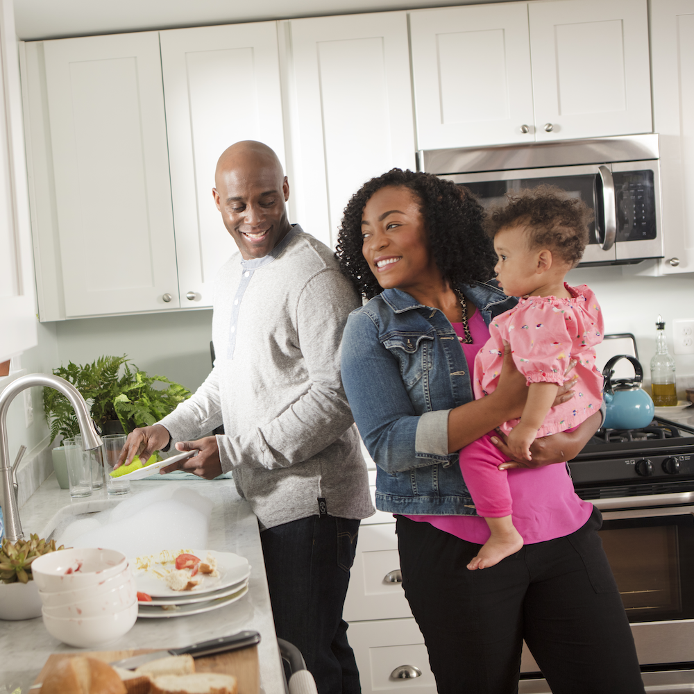 family doing dishes at home