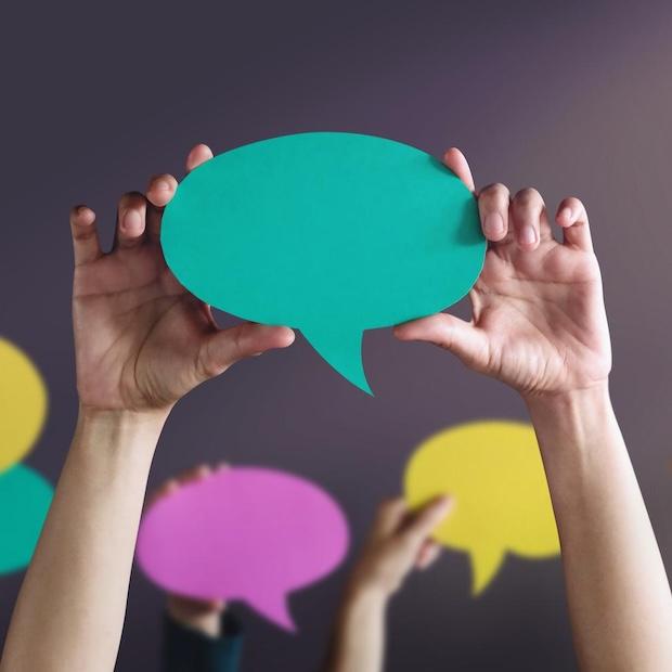 people holding up conversation bubbles - what Americans have to say about ESG