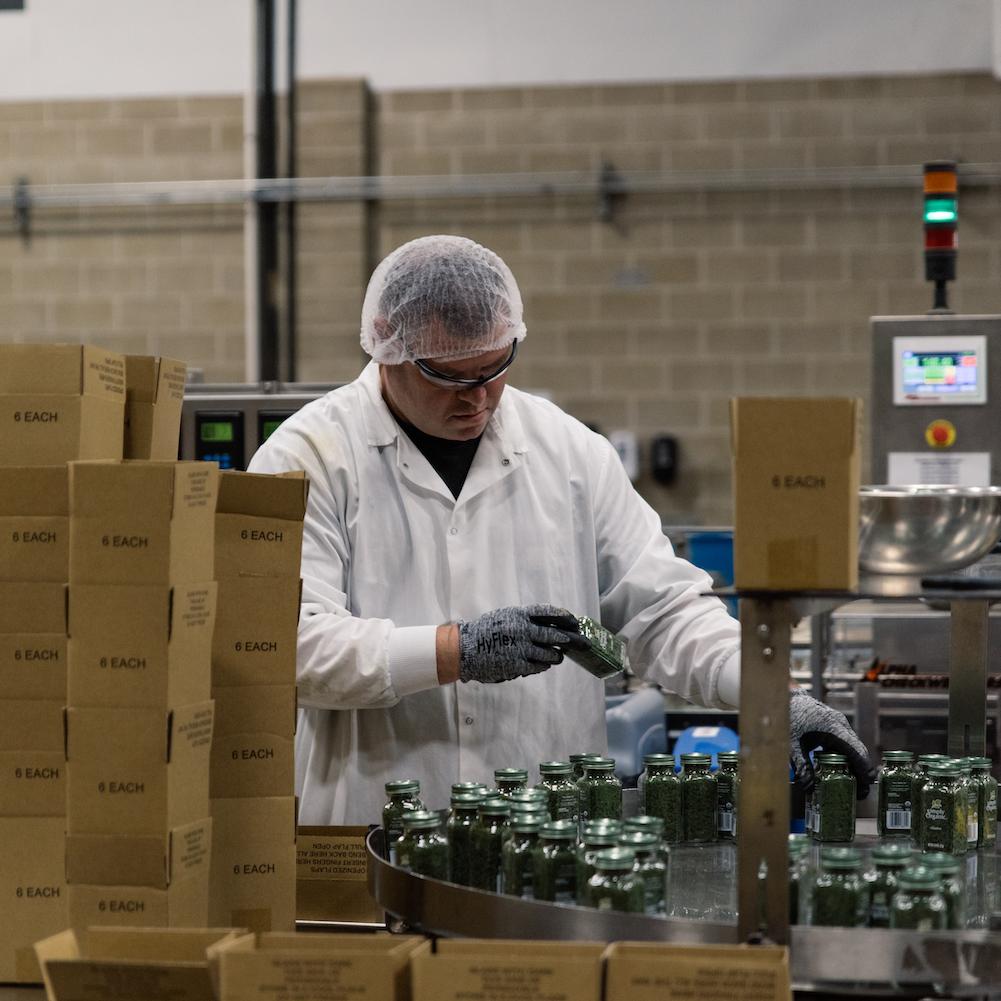 frontier co-op employee working in factory - company supports second chance hiring