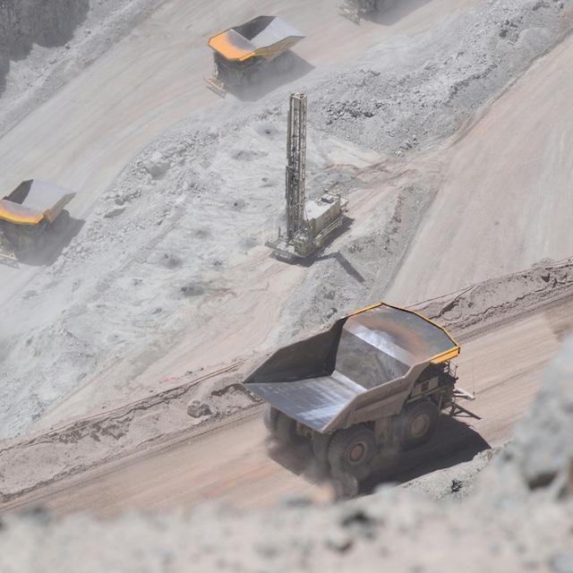 Dump trucks at the Chuquicamata mine in Chile — mining taxes