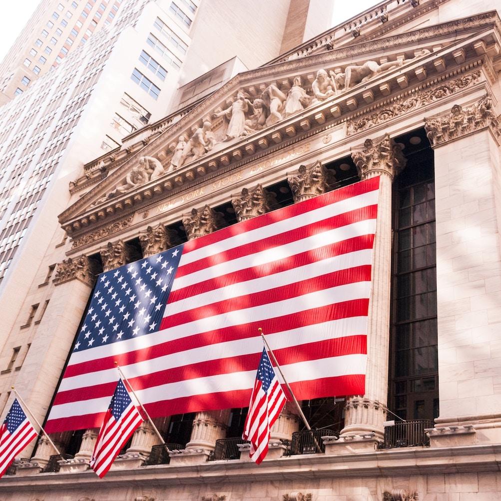 new york stock exchange in new york city with american flags - how is the american public responding to anti-esg anti-woke arguments