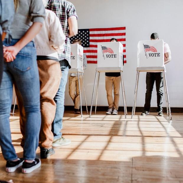 people standing in line to vote — commentary on us presidential debate