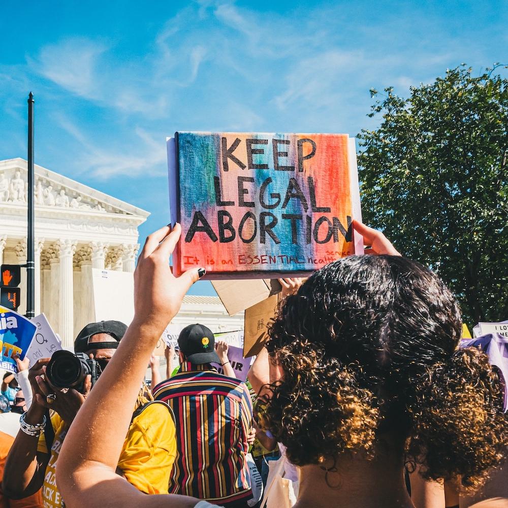 protest for reprodutive rights in washington dc - protester holds sign that reads keep legal abortion