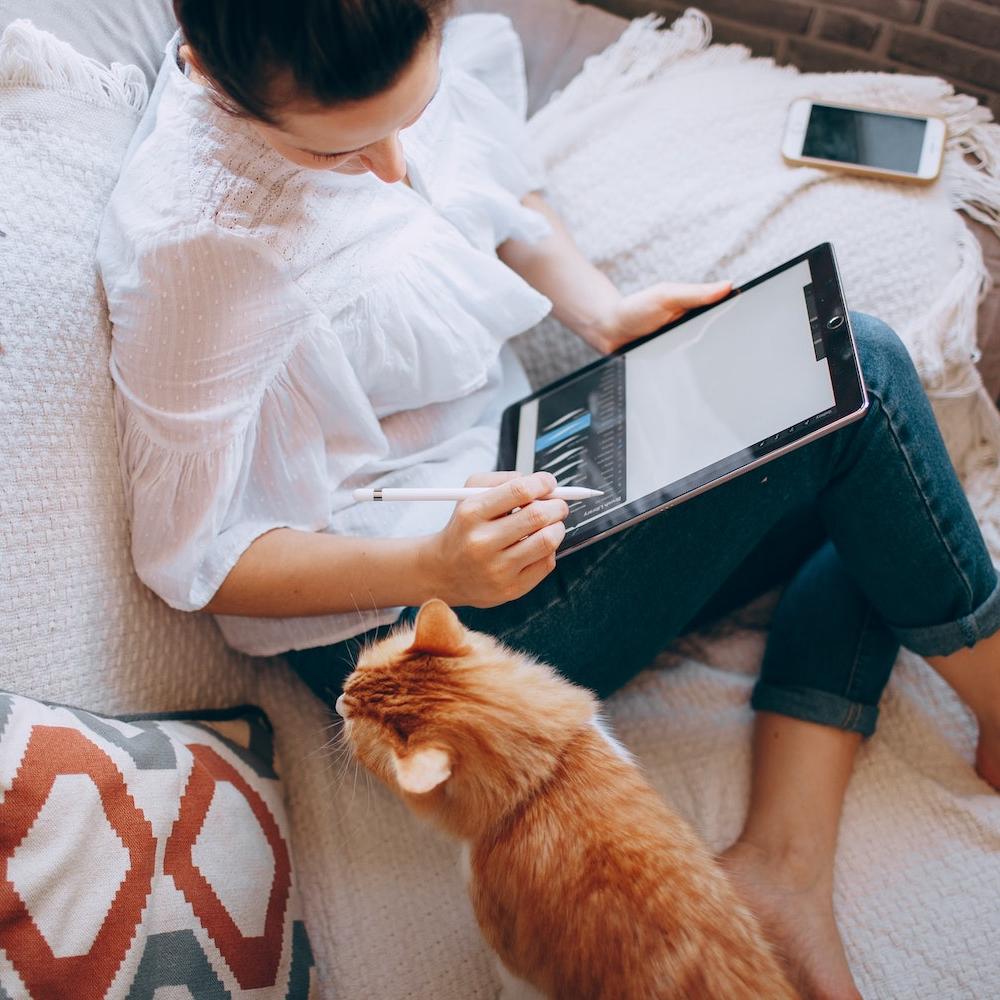 remote work - woman working from home with cat