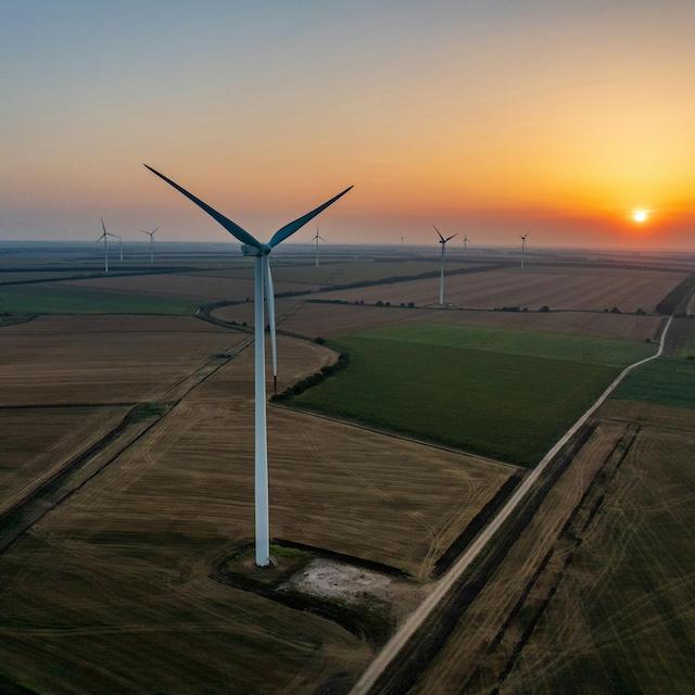A wind farm at sunset — renewable energy 