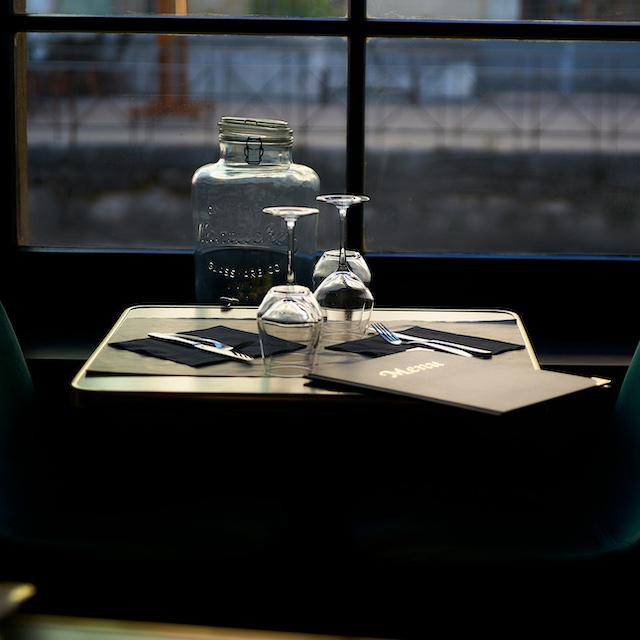 A menu on a table at a restaurant — restaurant sustainability 