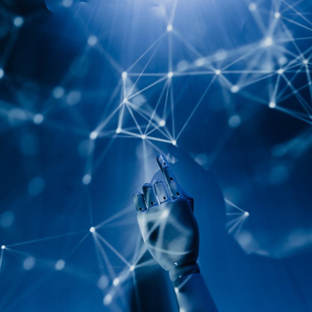 robot hand reaching into web of data - AI