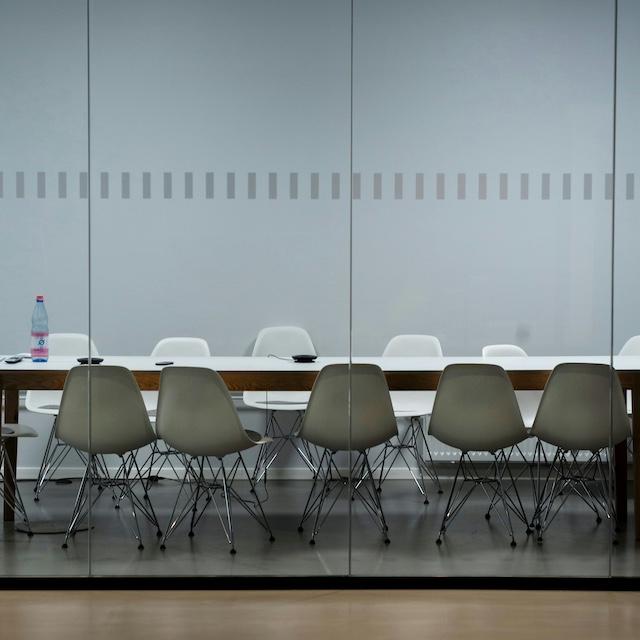 An empty boardroom table — sustainability reporting