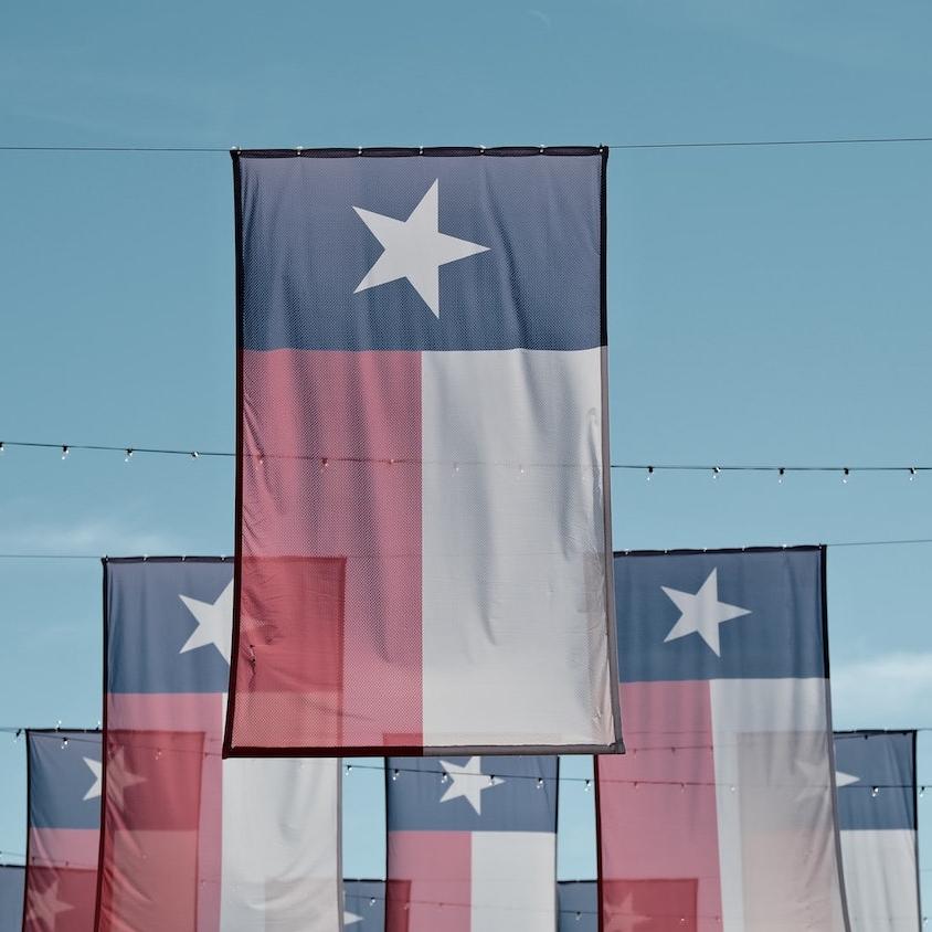 texas state flags - taxpayers in texas set to lose out on market for municipal green bonds