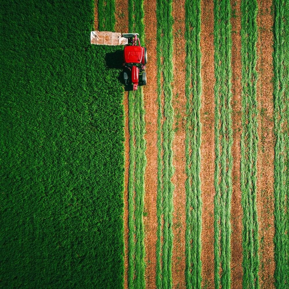 tractor mowing a field
