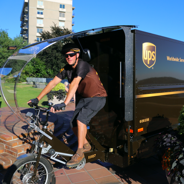 As UPS adds more hybrid and electric vehicles - and even bicycles - as it shifts to a low-carbon fleet, the rattle of the engine you hear as trucks pull up to your house with that coveted package could soon become a thing of the past.