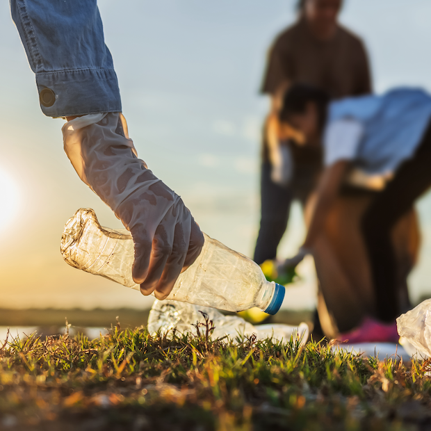 volunteers picking up plastic litter from park