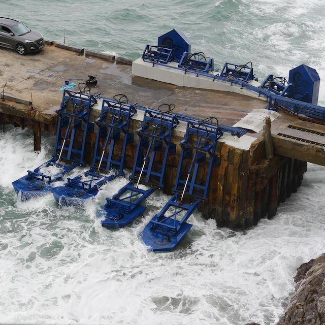 Eco Wave Power's wave energy devices attached to existing shoreline infrastructure.