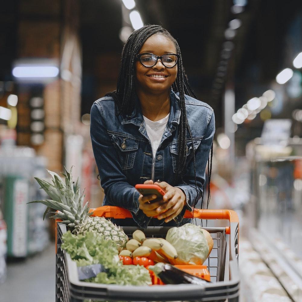 woman grocery shopping - consumers switching brands due to ESG factors