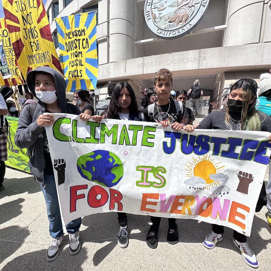 young people rally in front of california statehouse in support of climate justice